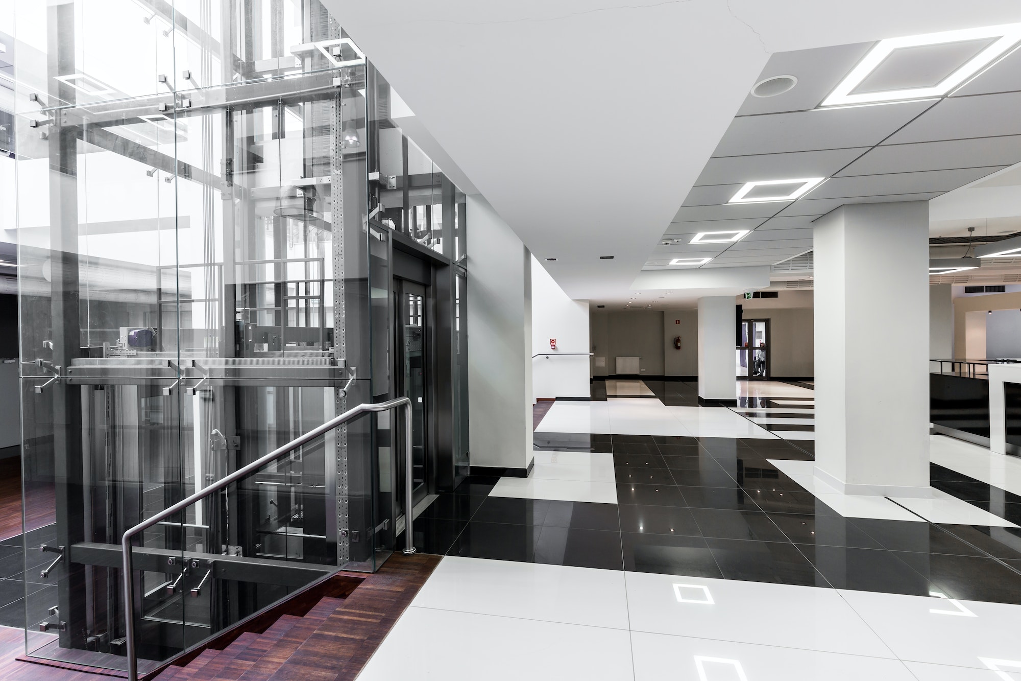 Modern hallway with glass elevator